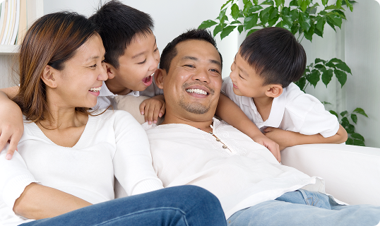 Happy family sitting together
